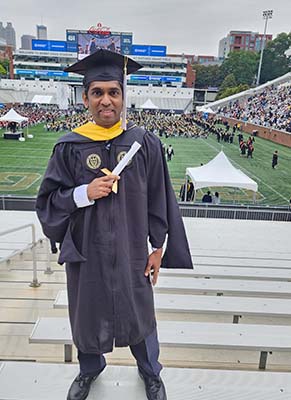 Abhilash Divakaran graduates with an OMSCS degree. (Photo by Priya Swarna)