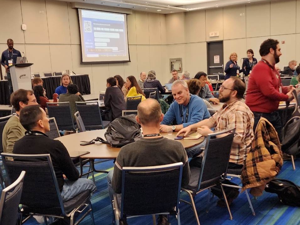 Groups ask questions and discuss teaching assistant programs at the SIGCSE conference in Toronto, Canada March 16.