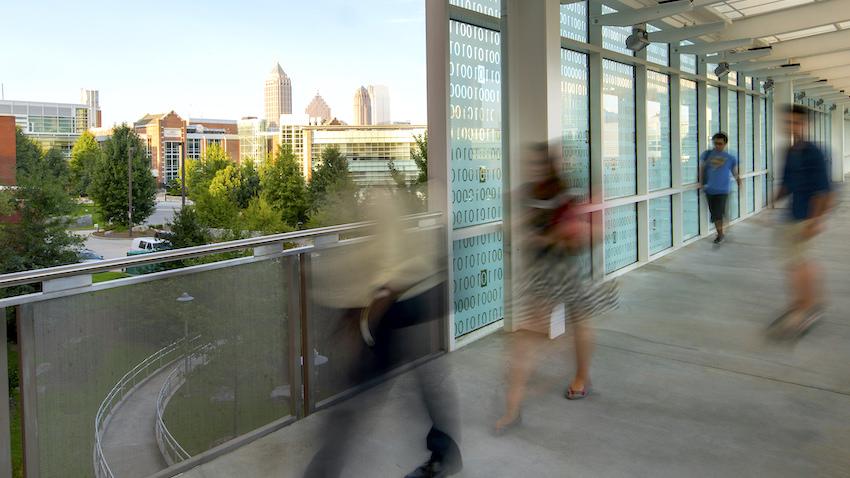 Binary Bridge at Georgia Tech with blurred pedestrians and a skateboarder