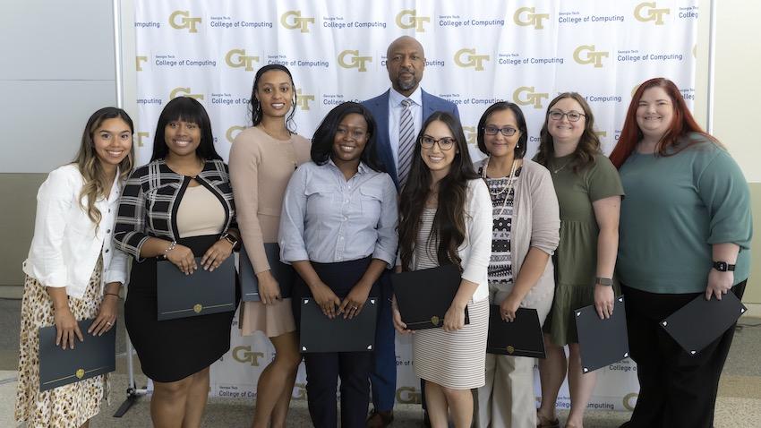 Group photo Georgia Tech Computing Dean Charles Isbell with OMSCS advising team during awards event