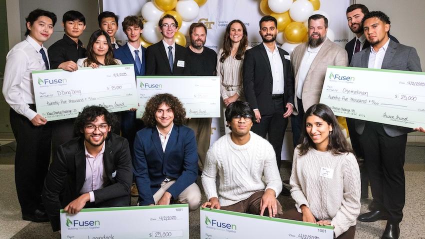 The winners of the 5th Annual Klaus Startup Challenge pose with their large cardboard checks from Fusen and the competition judges.