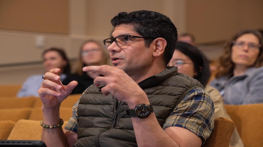 A member of the audience asks a question during Frontiers in Science.