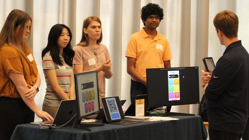 The student team presents their app to Judge and School of Computing Instruction Lecturer Ronnie Howard at the CS Junior Design Capstone Expo. Photos by Gregory White.