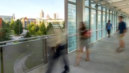 Binary Bridge at Georgia Tech with blurred pedestrians and a skateboarder