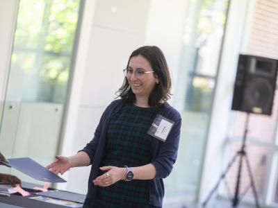 A woman accepting a certificate.