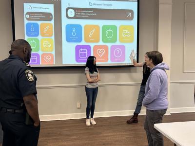 The student team presents the app to community leaders in DeKalb County. Photos by Gregory White.