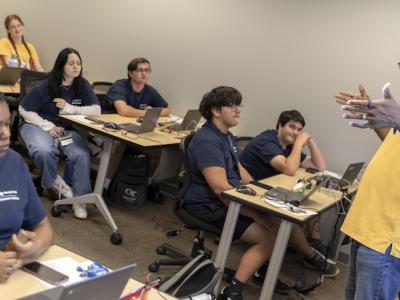 GT Computing Assistant Dean for Outreach Cedric Stallworth (right) is a longstanding advocate of sharing the creative side of computing with high school students.