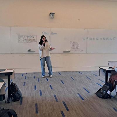 Student pitches a team's startup idea to the class. 