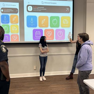 The student team presents the app to community leaders in DeKalb County. Photos by Gregory White.