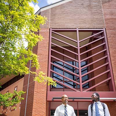 Father and son, Sababu and Tai'Re Barashango, share a bond through CS at Georgia Tech; Sababu as a Center for Education Fellow and Tai'Re as a graduating CS major. Photos by Kevin Beasley/ College of Computing.