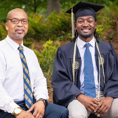 Sababu Barashango and Tai'Re Barashango celebrate Tai'Re’s graduation from Georgia Tech, marking the next step in his journey as a software engineer.